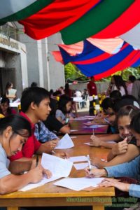 GETTING READY. Applications forms were filled-out  by the applicants who participated at the Job Fair before they continue to seek opportunities with the employers inside the Baguio Convention Center. Photo by Edselle Mae Ramat