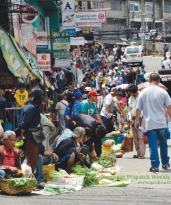 RIGHT OF WAY. Motorists and some pedestrians often complain about these vendors occupying portions of the Baguio Public Market roads causing traffic that the city government through its Public Order and Safety Division (POSD) conduct regular rounds confiscating and destroying the vendors’ wares. But the vendors keep on coming back, as most of them say, they would not eat if they do not sell on the streets. Photo by Delia Bagni