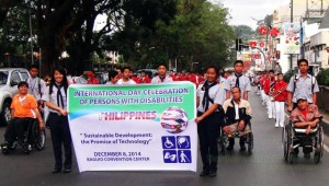 Leaders of the PWD Federation on their wheel chairs lead the parade on December 8. Photo by Arthur L. Allad-iw