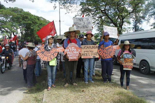 AT THE NOLCOM. Before the gates of Camp Aquino, north and central Luzon progressive groups drop by to decry militarization and military occupation of civilian communities in their regions. In the photo is the delegation from Cagayan Valley. Photo by Rendilyn Cuyop