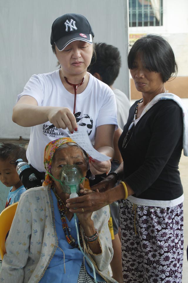 SERVE THE PEOPLE. Dr. Melindres Jaramillo-Lim, sister of Arnold “Ka Mando” Jaramillo, a New People’s Army rebel killed in 2014 joined a medical mission in Lacub, Abra where her brother spent his last years. Photo by Divine Loraine Peñaflor