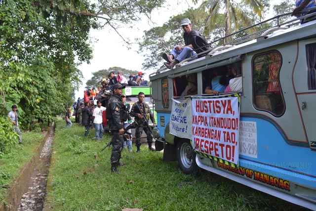 CHECK POINT. Soldiers in full battle gear at the 77th Infantry Battalion in Bantay, Tabuk motioned the caravan of the delegates for the International Human Rights Day celebration to stop for check point. Delegates claim it as a form of harassment because soldiers did not give any reason. Photo by Alma B. Sinumlag